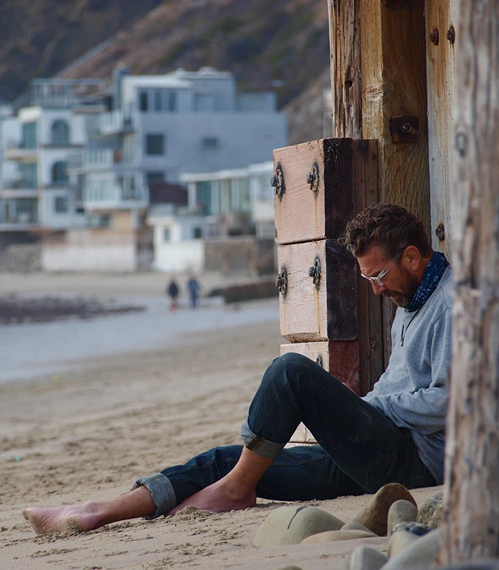Photo of Author David Bookman writing on the ebach Photo of Author David Bookman writing on the ebach